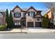 Beautiful brick home featuring a two-car garage, manicured landscaping, and a welcoming front entrance at 230 Society St, Alpharetta, GA 30022