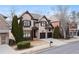 Charming brick two-story home with a well-maintained lawn, a two-car garage, and appealing curb appeal at 230 Society St, Alpharetta, GA 30022