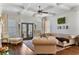 Inviting living room with coffered ceilings, hardwood floors, and French doors leading to the outdoors at 230 Society St, Alpharetta, GA 30022