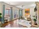 Cozy living room with a stone fireplace, an accent chair, and patio access at 230 Society St, Alpharetta, GA 30022