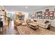 Cozy living room with stone fireplace, leather seating, and ornate rug at 230 Society St, Alpharetta, GA 30022