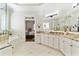Bright main bathroom featuring dual vanities with granite countertops and tile flooring at 230 Society St, Alpharetta, GA 30022