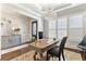 Stylish office space with hardwood floors, bright windows, and a sophisticated chandelier at 230 Society St, Alpharetta, GA 30022