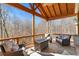 Relaxing outdoor living area with a wooded view, comfortable seating, and natural light at 230 Society St, Alpharetta, GA 30022