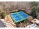 An aerial view of well-maintained community tennis courts shows the surrounding trees at 230 Society St, Alpharetta, GA 30022