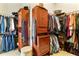 Spacious walk-in closet with custom shelving, cabinets, and ample hanging space at 230 Society St, Alpharetta, GA 30022