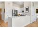 Bright kitchen boasts stainless steel appliances, stone countertops, and wood flooring at 384 Ralph Mcgill Ne Blvd # 314, Atlanta, GA 30312