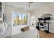 Bright bedroom with hardwood floors, a modern ceiling fan, and balcony access at 384 Ralph Mcgill Ne Blvd # 314, Atlanta, GA 30312