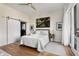 Bright bedroom with a modern ceiling fan, closet, and access to a private outdoor balcony at 384 Ralph Mcgill Ne Blvd # 314, Atlanta, GA 30312