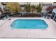 Rectangular swimming pool surrounded by light grey deck, iron fencing, and garden area at 384 Ralph Mcgill Ne Blvd # 314, Atlanta, GA 30312