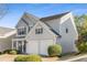 Traditional two-story home with gray siding, an attached two-car garage, and a well-manicured front lawn at 620 Dahoma Trl, Woodstock, GA 30188