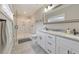 Modern bathroom with dual vanities, granite countertops, and a walk-in shower at 1591 Alder Se Ct, Atlanta, GA 30317