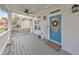 Charming front porch featuring a blue door, ceiling fan, and comfortable seating at 1591 Alder Se Ct, Atlanta, GA 30317