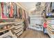 Spacious walk-in closet featuring custom shelving, ample storage, and wood-look flooring at 1591 Alder Se Ct, Atlanta, GA 30317