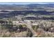 Aerial view of community and surrounding landscape near a commercial area at 2557 Sixes Rd, Canton, GA 30114