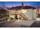 Exterior shot of a house featuring a deck with stairs and a charming swing at dusk at 2557 Sixes Rd, Canton, GA 30114