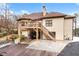 View of the house with a wooden deck, stairs, and a cozy swing in the backyard at 2557 Sixes Rd, Canton, GA 30114