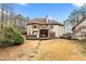 Expansive backyard with stone path leading to the house, complete with a deck and swing at 2557 Sixes Rd, Canton, GA 30114