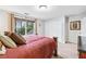 Another view of the comfortable bedroom with warm wood furnishings and a large window offering ample natural light at 2557 Sixes Rd, Canton, GA 30114