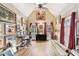 Bright bonus room featuring hardwood floors, vaulted ceiling, and natural light with a ceiling fan at 2557 Sixes Rd, Canton, GA 30114