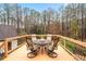 Wooden deck features outdoor seating area overlooking the yard at 2557 Sixes Rd, Canton, GA 30114