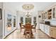 Second dining area with hardwood floors and a view to the outdoor deck, perfect for relaxing at 2557 Sixes Rd, Canton, GA 30114