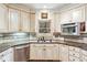 Kitchen with stainless steel dishwasher, granite counters and cabinets with contrasting hardware at 2557 Sixes Rd, Canton, GA 30114