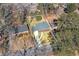 Aerial view of property in neighborhood with mature trees, and outlined property boundaries at 2569 Woodhill Ln, Atlanta, GA 30344