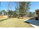 The flat backyard has new sod, a concrete patio, and a privacy fence for leisure at 2569 Woodhill Ln, Atlanta, GA 30344