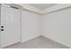 Finished basement with a bright white door and tiled flooring at 2569 Woodhill Ln, Atlanta, GA 30344