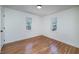 Bright bedroom with hardwood floors and two windows offering natural light and pleasant views at 2569 Woodhill Ln, Atlanta, GA 30344