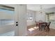 Bright dining room showcasing hardwood floors, a modern chandelier, and a window with natural light at 2569 Woodhill Ln, Atlanta, GA 30344