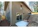 Exterior home view shows sliding door with steps leading up to the backyard at 2569 Woodhill Ln, Atlanta, GA 30344