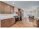 Modern kitchen with stainless steel appliances, hardwood floors, and an adjacent dining area at 2569 Woodhill Ln, Atlanta, GA 30344