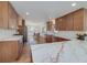 Spacious kitchen featuring custom cabinets, stainless steel appliances, and beautiful marble countertops at 2569 Woodhill Ln, Atlanta, GA 30344