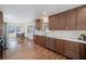 Open concept kitchen with stainless steel appliances, custom cabinetry, and breakfast bar at 2569 Woodhill Ln, Atlanta, GA 30344