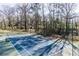 A well-maintained tennis court with surrounding fencing offers an opportunity for recreation and a healthy lifestyle at 2569 Woodhill Ln, Atlanta, GA 30344