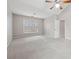 Large bedroom with a vaulted ceiling, carpeted floors, and two windows with natural light at 6491 Stonelake Sw Pl, Atlanta, GA 30331