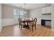 Dining room showcasing a wooden table, four chairs, and bright, natural light at 6491 Stonelake Sw Pl, Atlanta, GA 30331