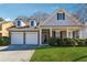 Charming brick home with a well-manicured lawn, two-car garage, and inviting front porch at 6491 Stonelake Sw Pl, Atlanta, GA 30331