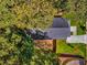 Aerial view of a home showing the roof, driveway, and surrounding mature trees at 891 Thurmond Nw St, Atlanta, GA 30314