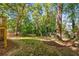 Large backyard featuring mature trees, grass, and a wooden fence for privacy at 891 Thurmond Nw St, Atlanta, GA 30314