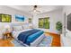 A staged bedroom features natural lighting and decor at 891 Thurmond Nw St, Atlanta, GA 30314