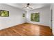 Bright bedroom with hardwood floors, a ceiling fan, and multiple windows offering natural light at 891 Thurmond Nw St, Atlanta, GA 30314