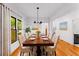 Elegantly staged dining room with a large table, chairs, and a modern chandelier, perfect for gatherings at 891 Thurmond Nw St, Atlanta, GA 30314