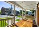 Inviting front porch boasts wood flooring, white railings, and a great view of the neighborhood at 891 Thurmond Nw St, Atlanta, GA 30314