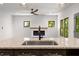 Kitchen featuring granite island, stainless steel appliances, and a view of the living area with fireplace at 891 Thurmond Nw St, Atlanta, GA 30314