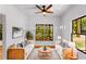 Cozy living room with stylish furnishings, a ceiling fan, and natural light streaming through the windows at 891 Thurmond Nw St, Atlanta, GA 30314