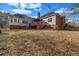 Spacious backyard with a deck, brick exterior, and mature trees at 1450 Brandy Shoals Se Dr, Conyers, GA 30013