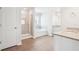 Bright bathroom with a glass shower, soaking tub, double vanity, and neutral tiling at 2025 Wyndham Pl, Conyers, GA 30013